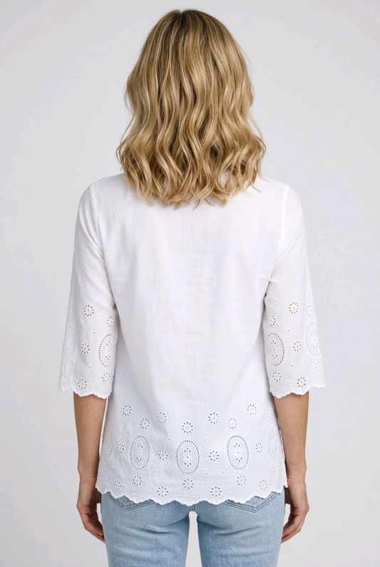 Woman wearing a white decorative top