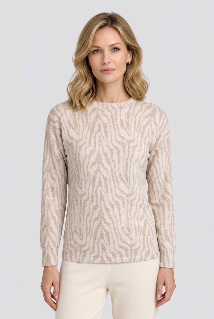 Woman wearing a beige patterned sweater 