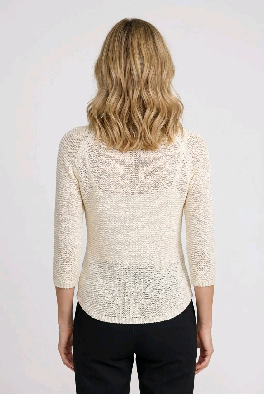 Woman wearing a cream-colored sweater 