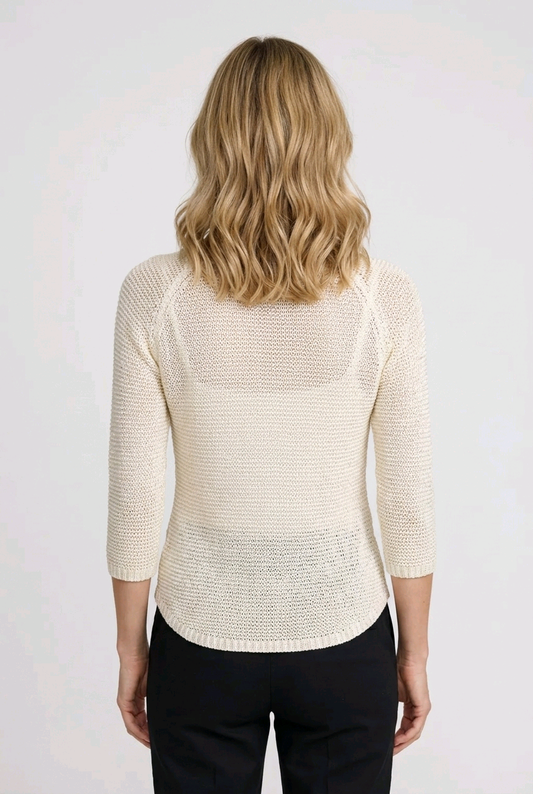 Woman wearing a cream-colored sweater 