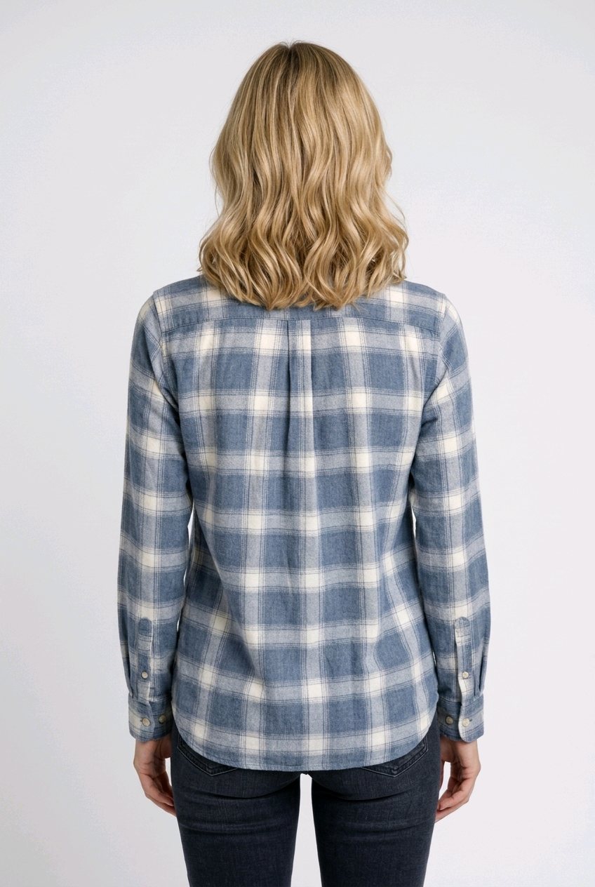 Woman wearing a blue and white plaid shirt 