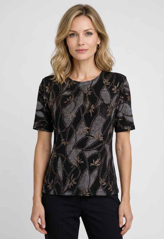 Woman wearing a black patterned top