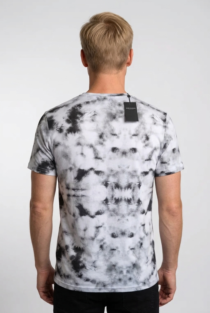 Person wearing a black and white tie-dye t-shirt 