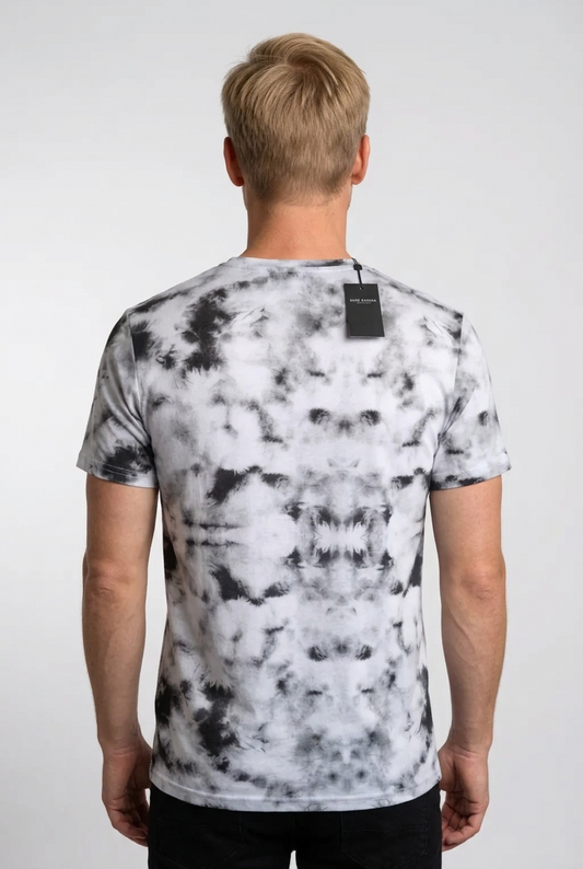 Person wearing a black and white tie-dye t-shirt 