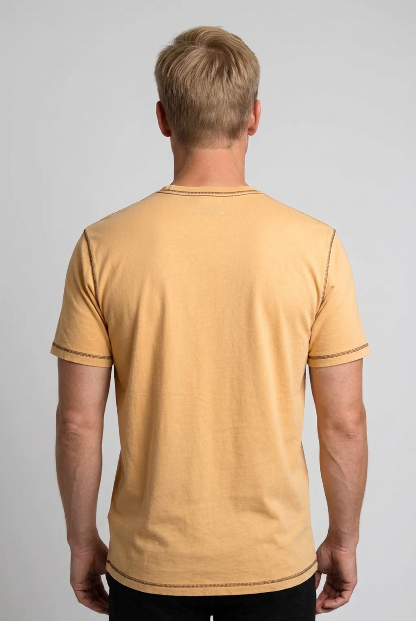 Man wearing a mustard yellow t-shirt 