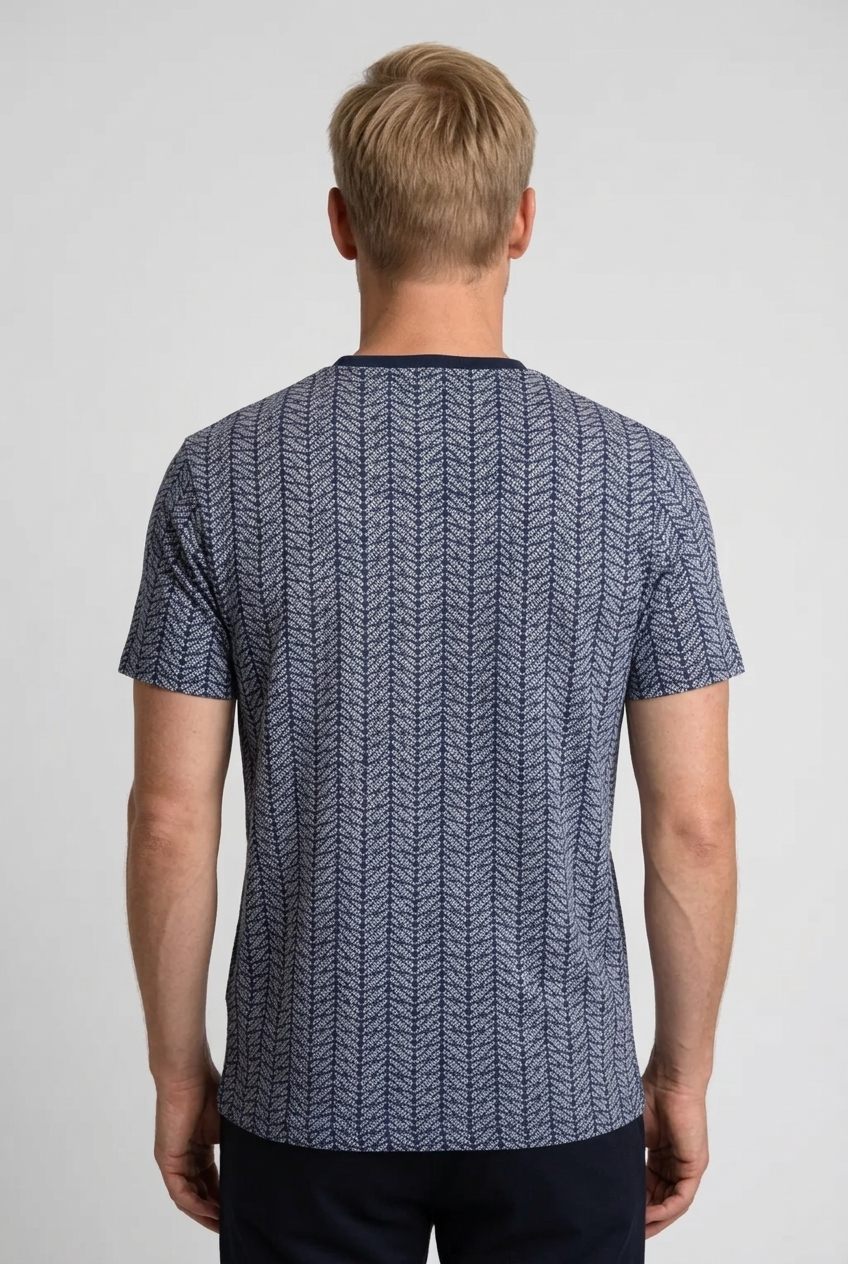 Person wearing a blue patterned t-shirt 