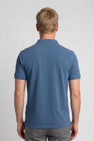 Man wearing a blue polo shirt 