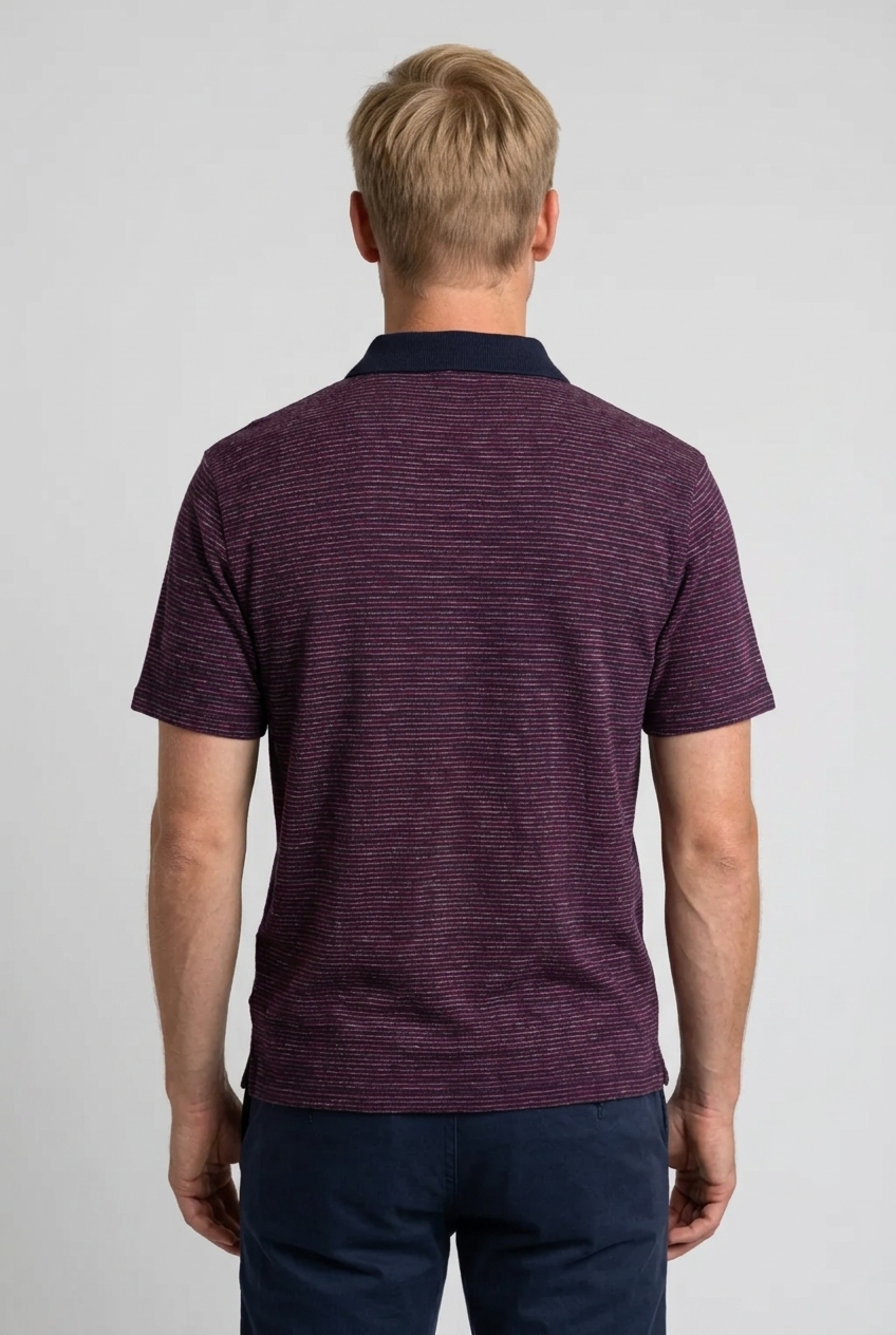 Man wearing a maroon striped polo shirt 