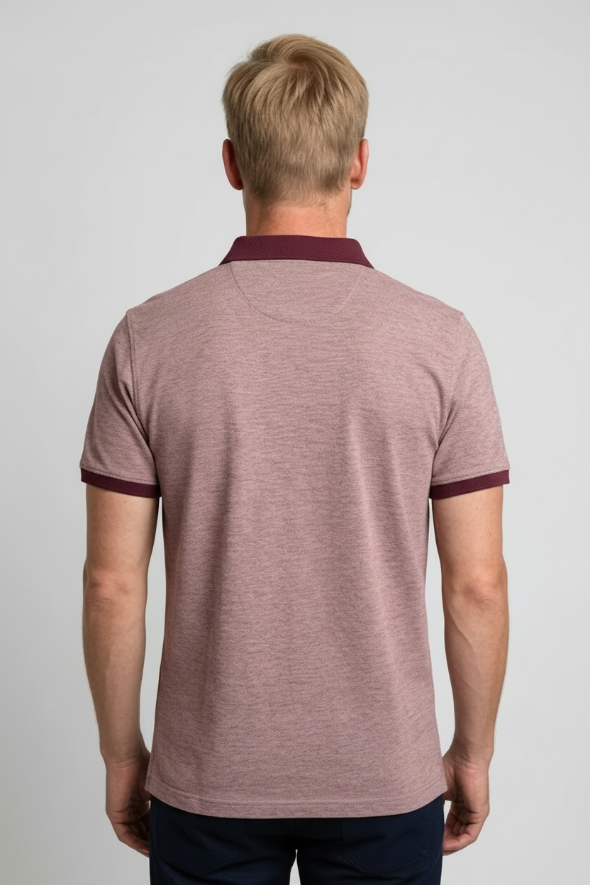 Man wearing a maroon polo shirt with burgundy trim