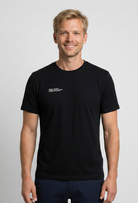 Man wearing a black t-shirt with text 