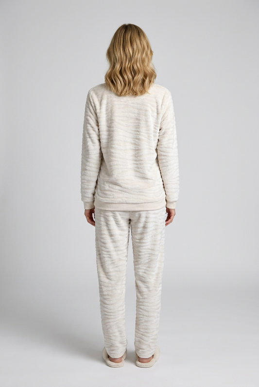 Woman wearing a cream striped pajama 