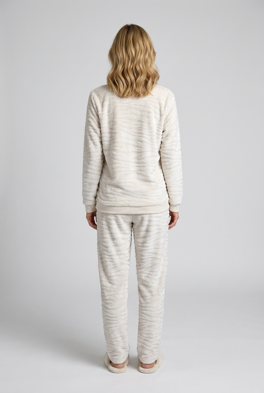 Woman wearing a cream striped pajama 