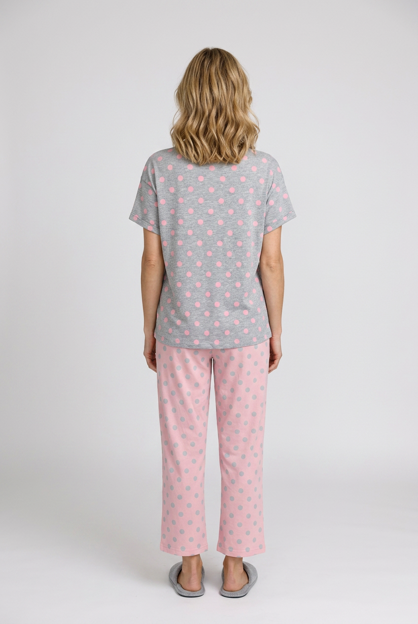 Woman wearing a grey t-shirt pink pyjama set