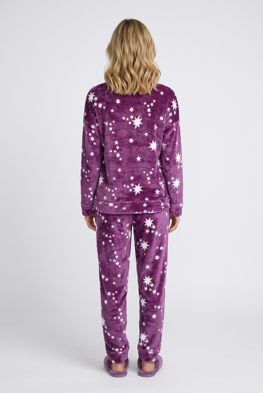 Woman wearing purple pajamas with star pattern