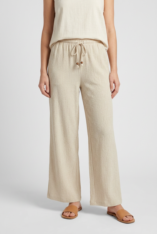 Woman wearing beige wide-leg pants 