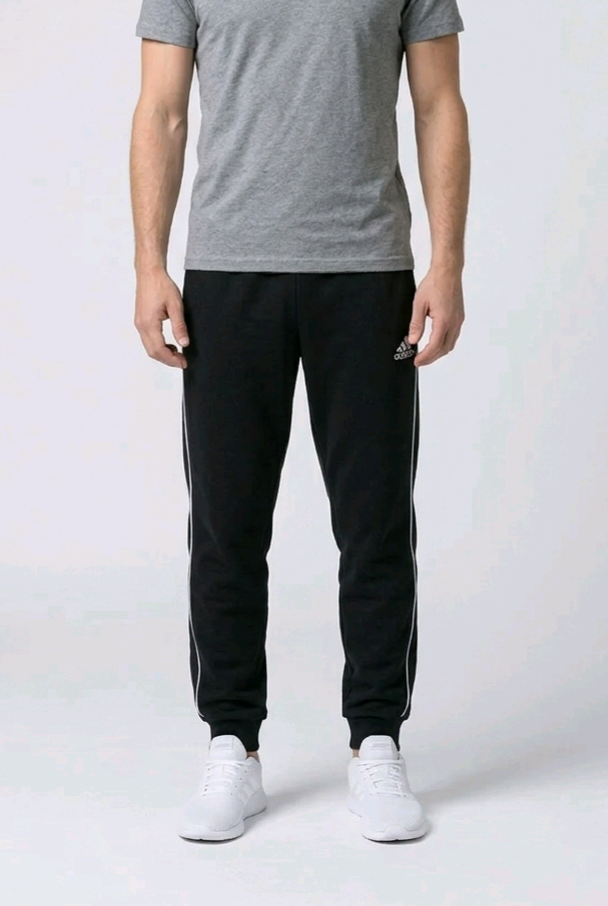 Close up of a man wearing a pair of Adidas joggers size XL front view