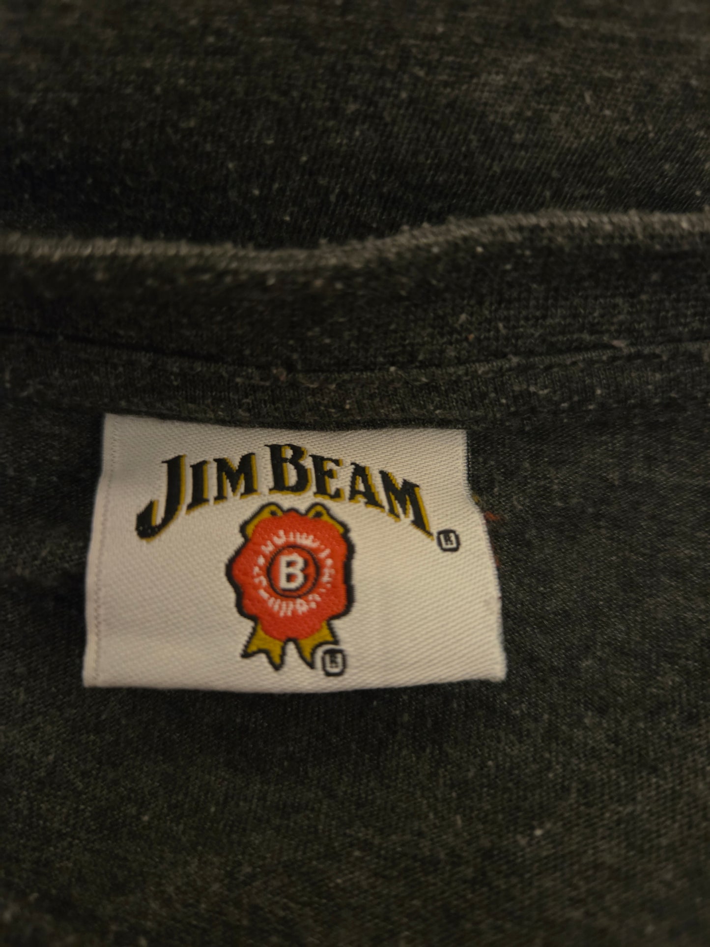 Jim Beam label on a dark fabric background