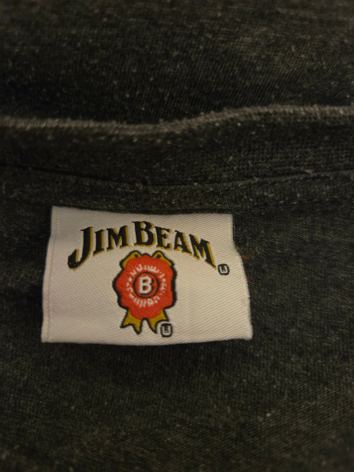 Jim Beam label on a dark fabric background