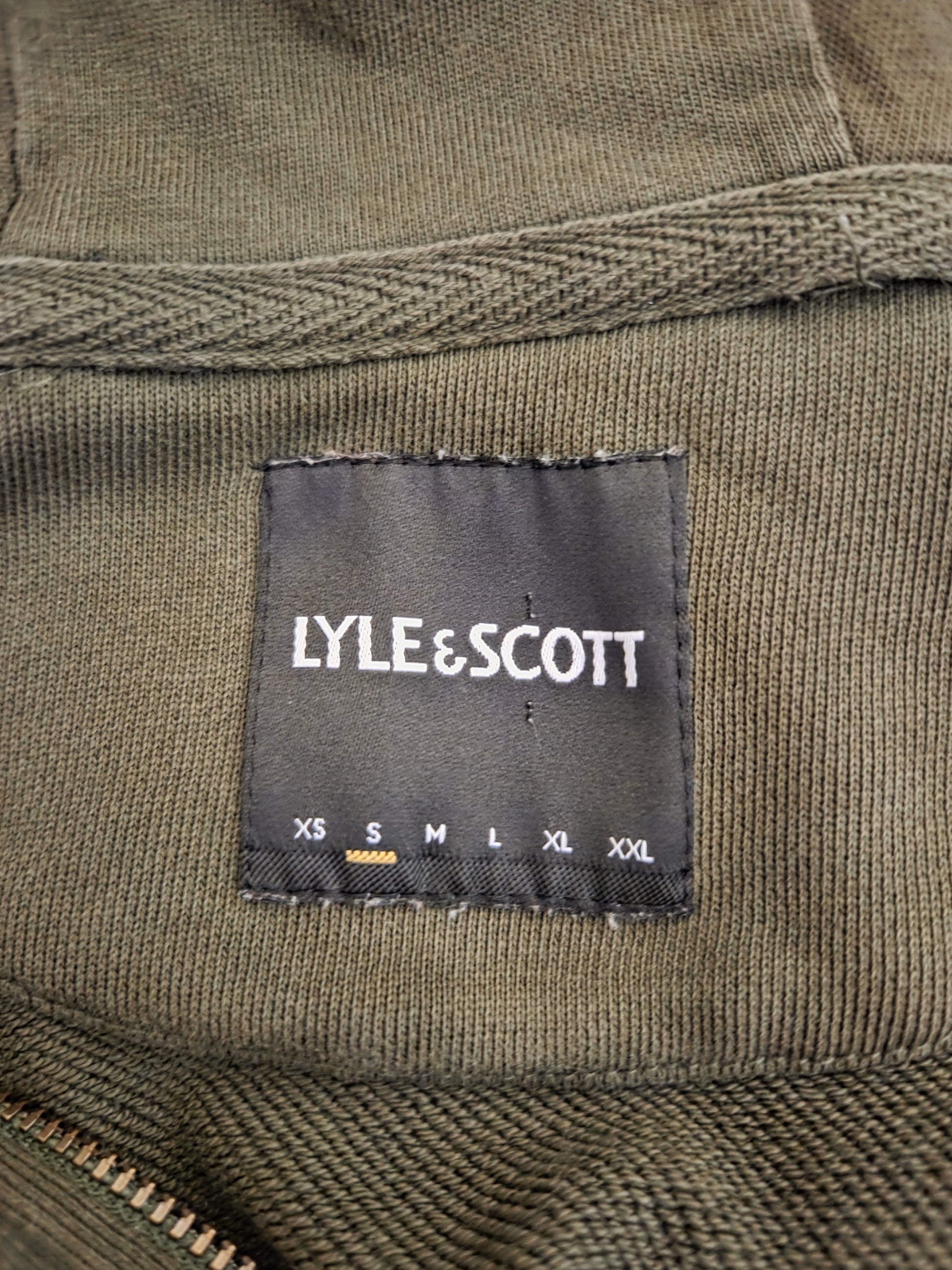 Close-up of hoodie label showing size and brand details