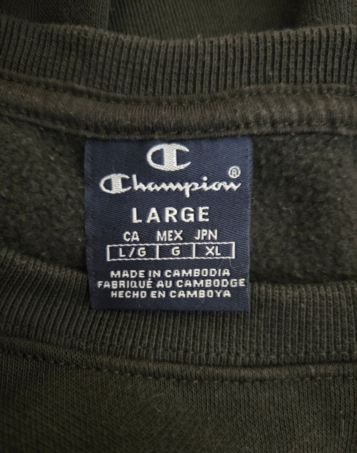 Champion label on a black fabric background