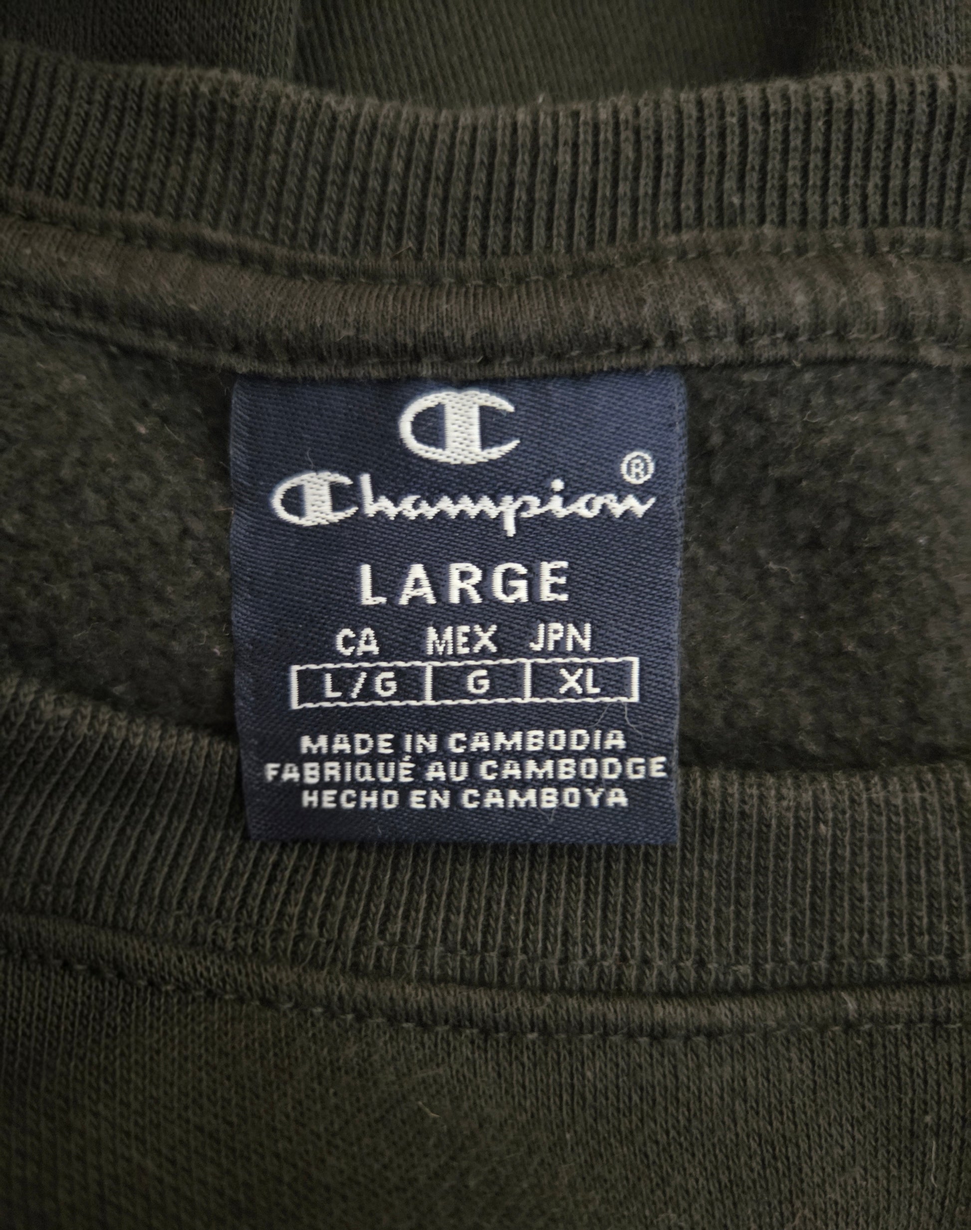 Champion label on a black fabric background