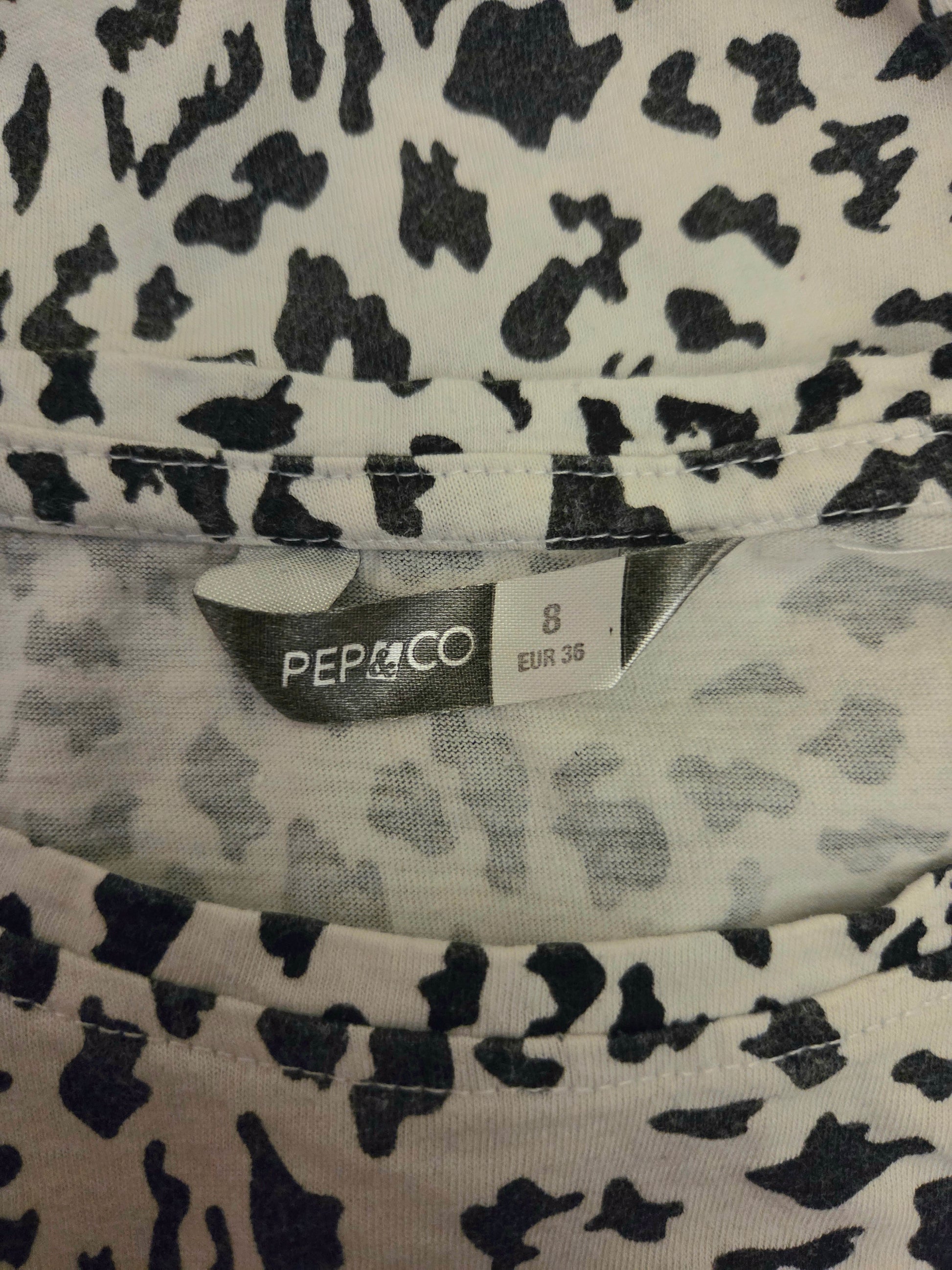 Clothing with a black and white pattern and a visible PEP&CO size label.