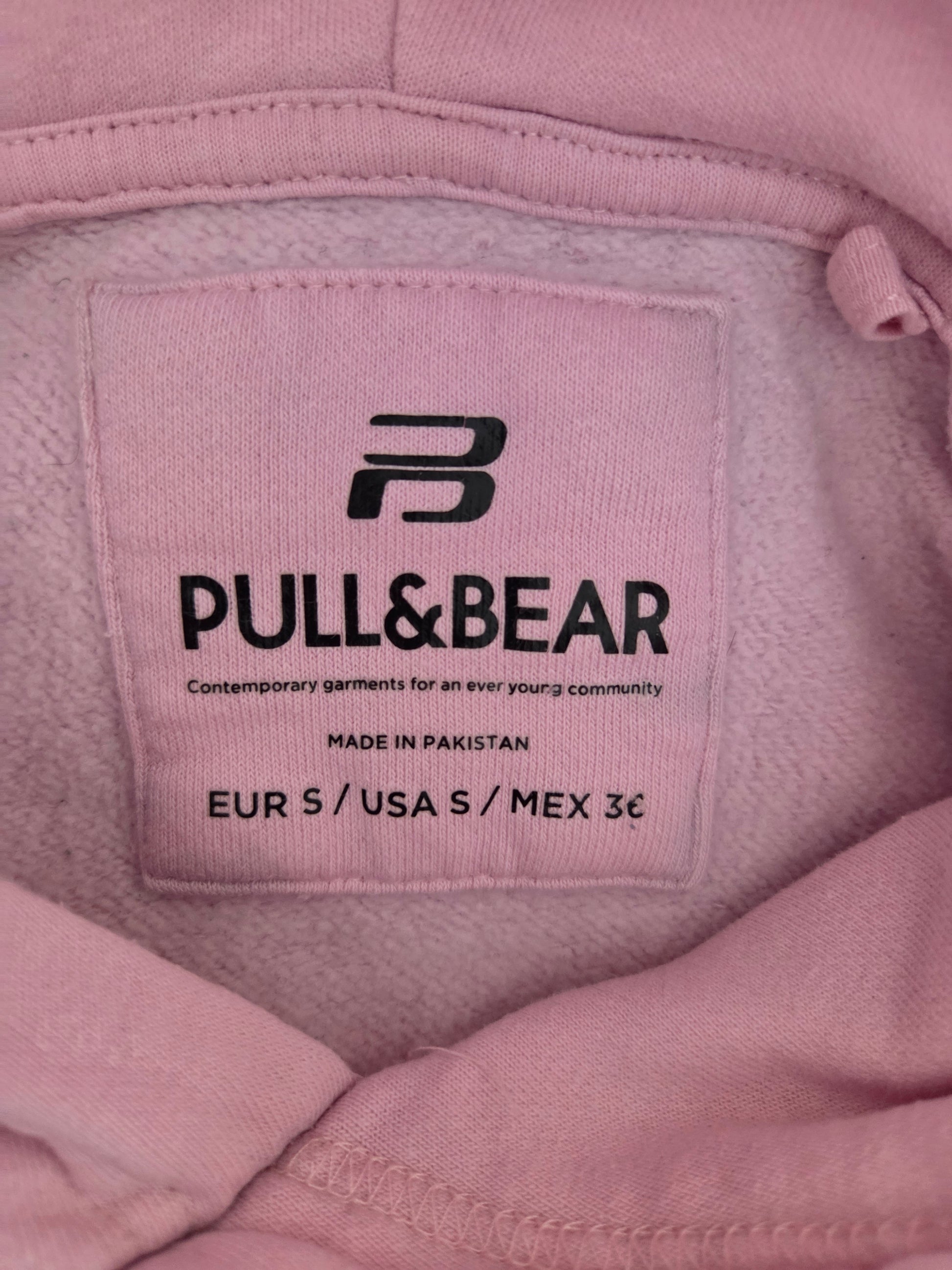 Pink Pull & Bear hoodie label with size and country of origin