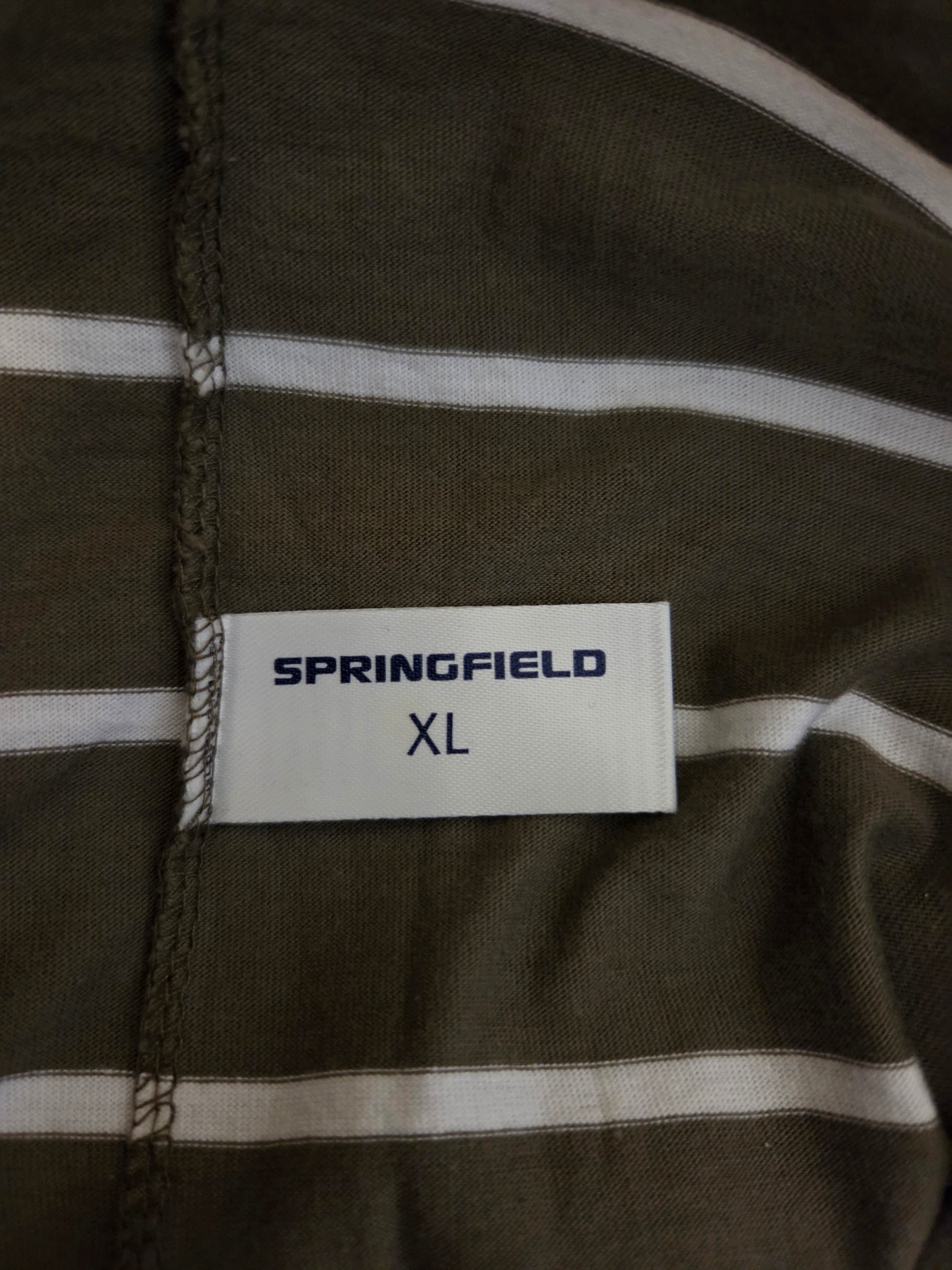 Close-up of a label on a piece of fabric with 'Springfield' branding.
