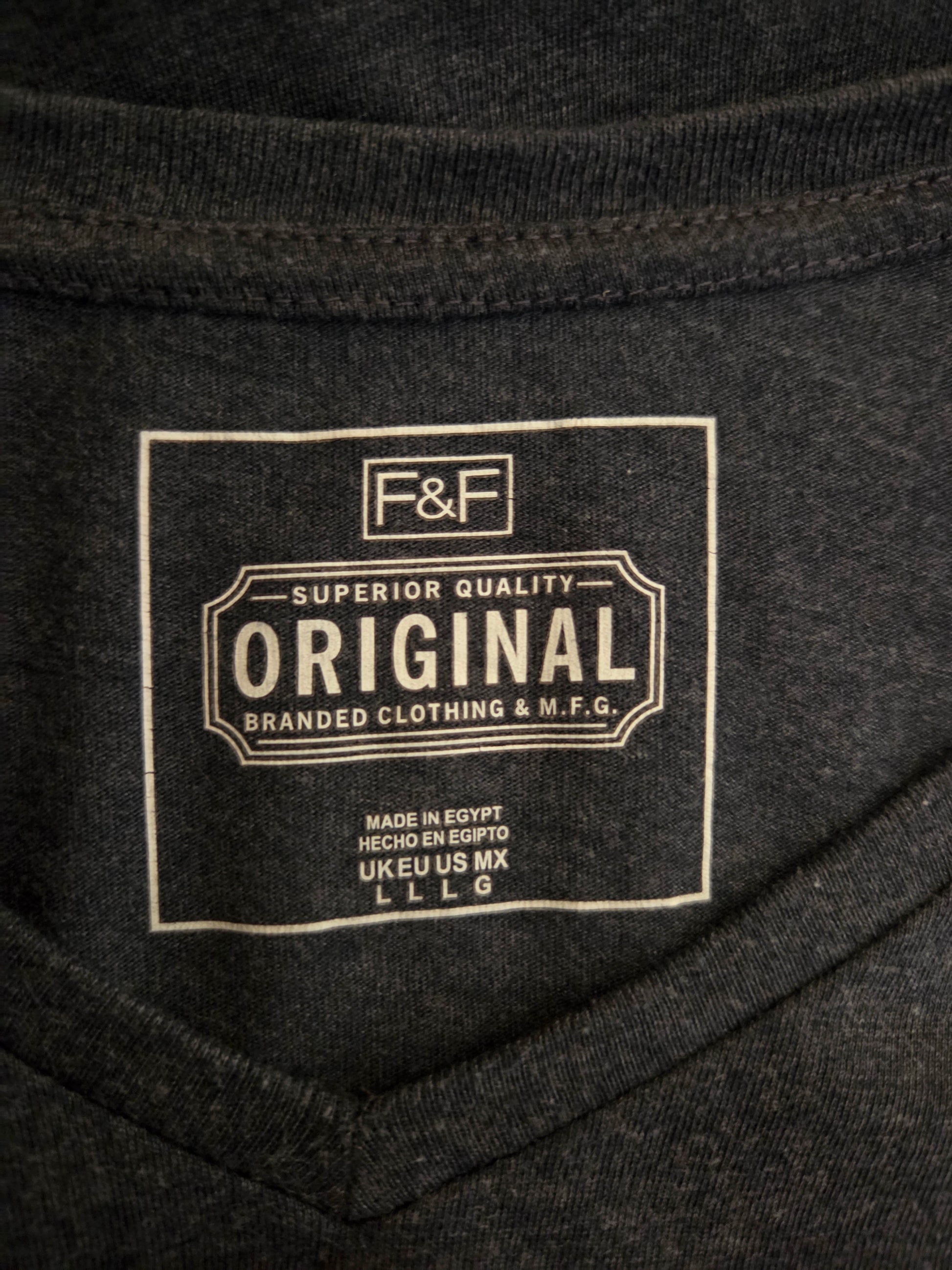 Close-up of a branded label on a dark fabric background