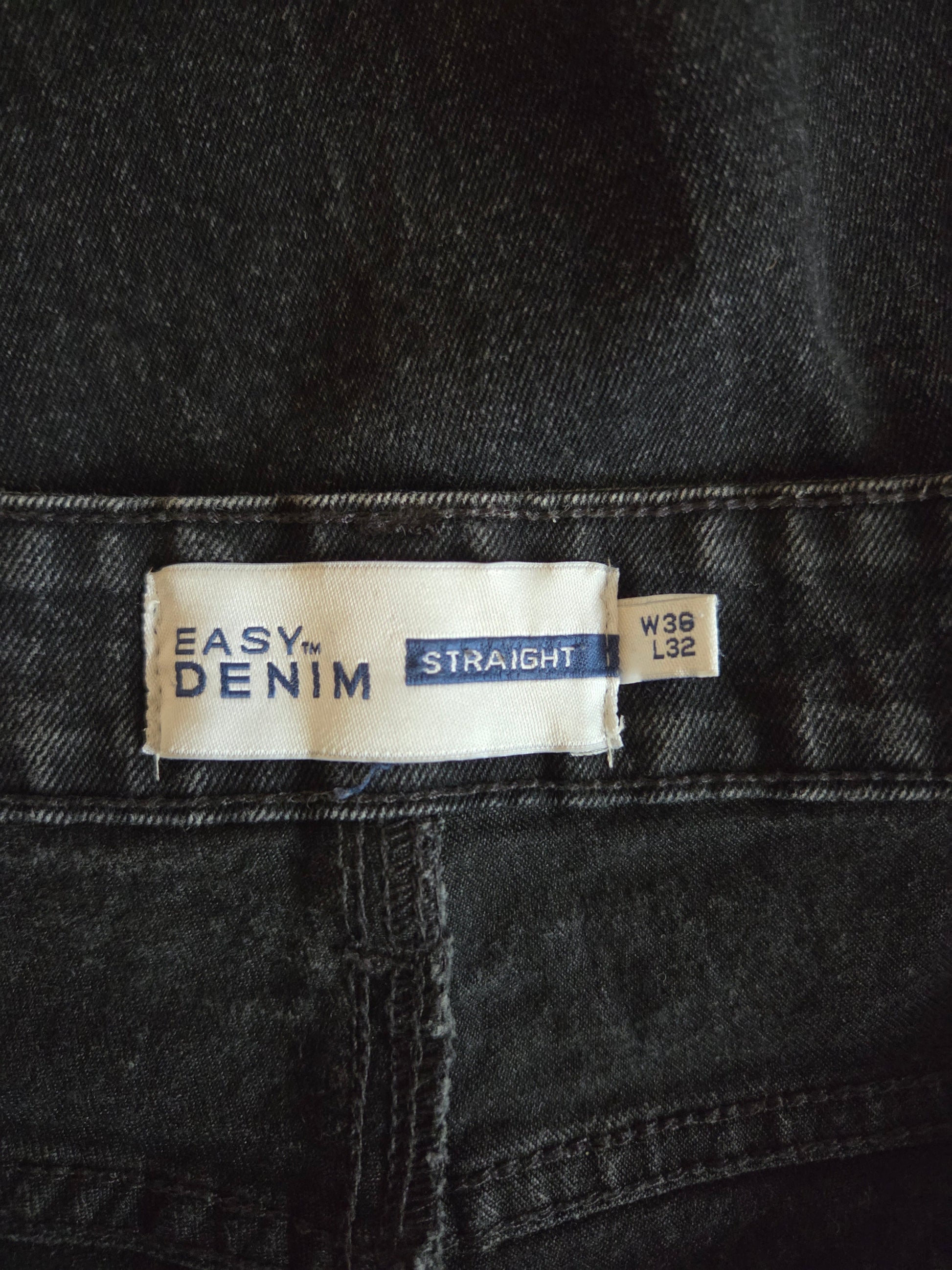 Size label on a pair of black jeans