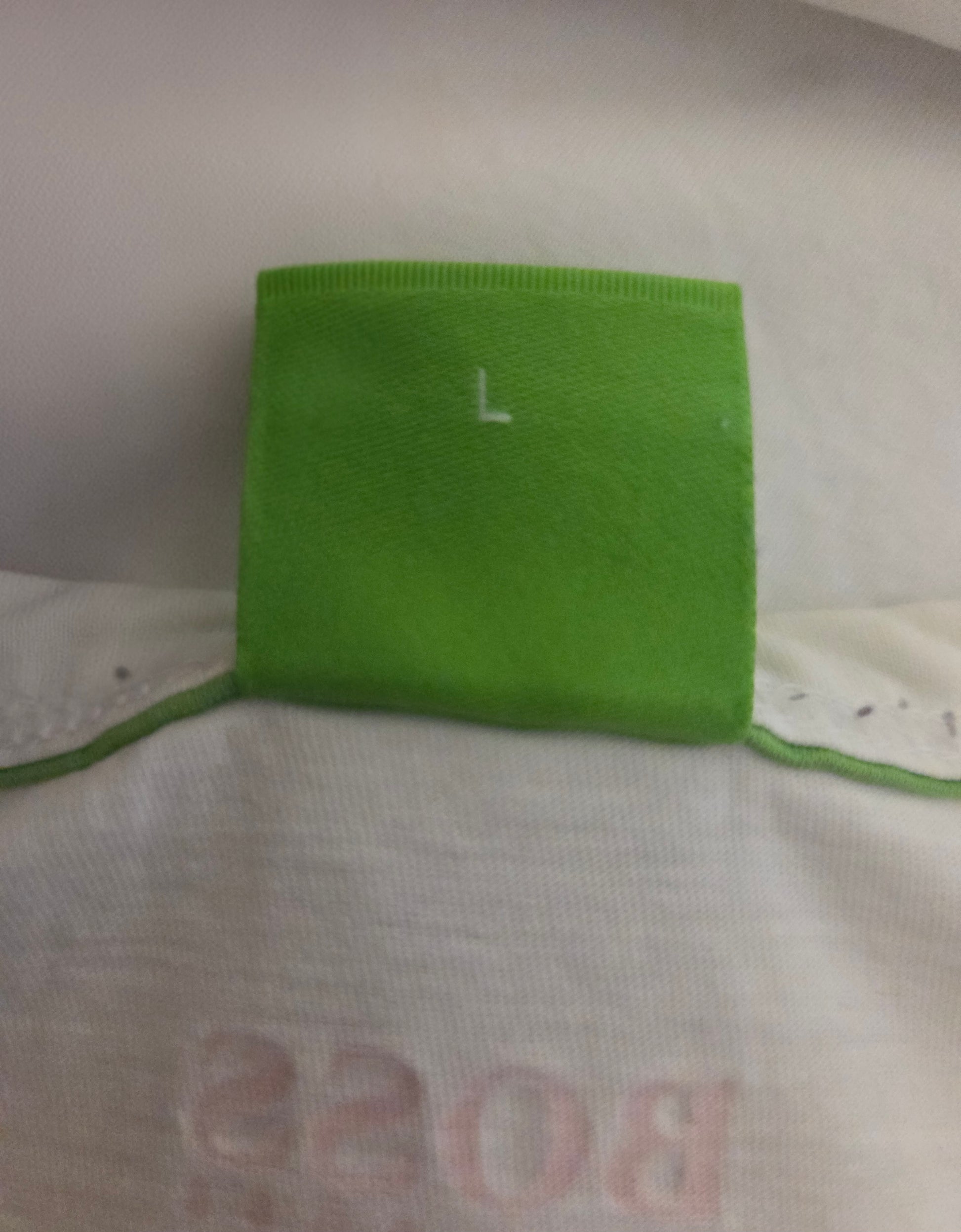 Green size fabric square with a letter 'L' 