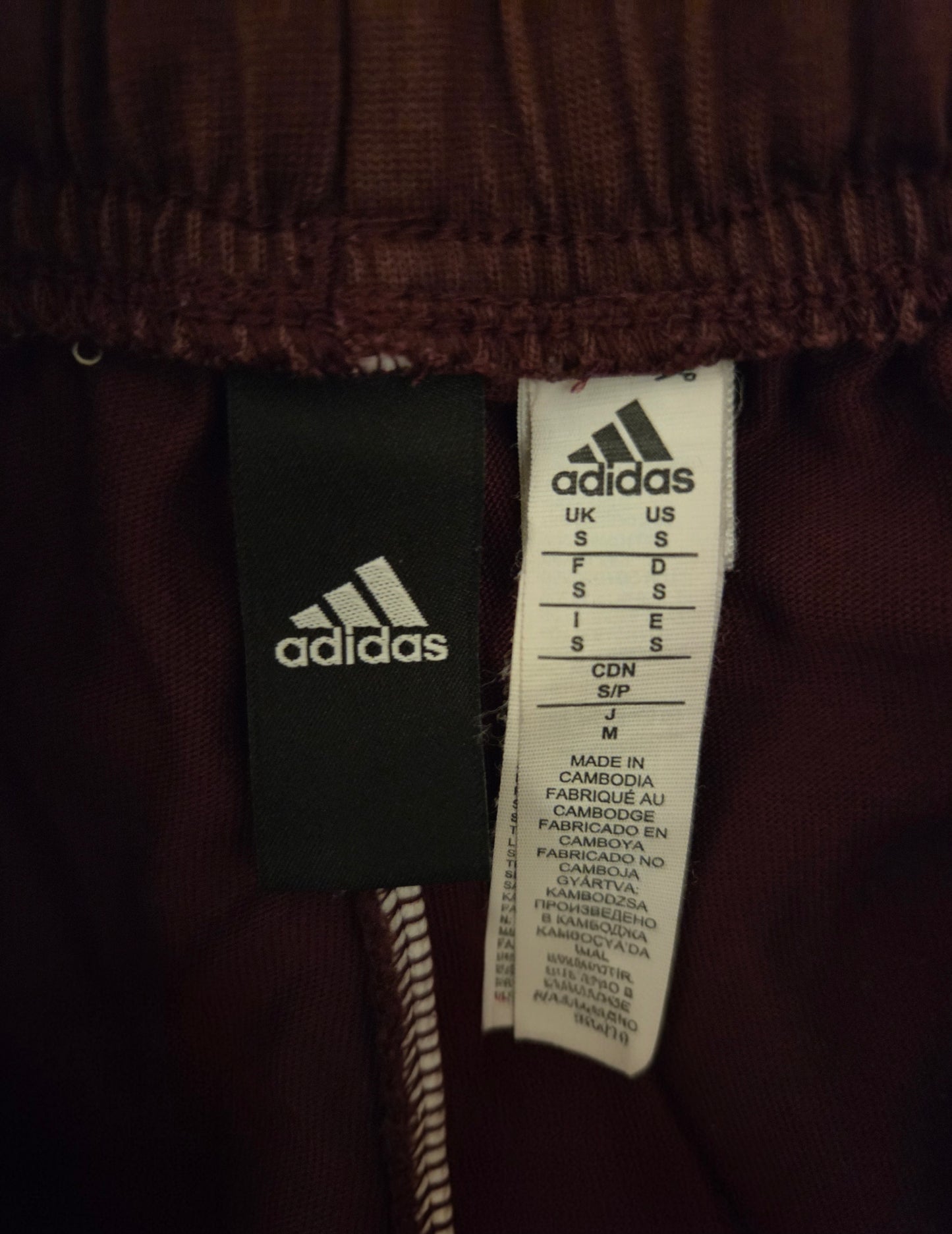 Size label showing the Adidas sign