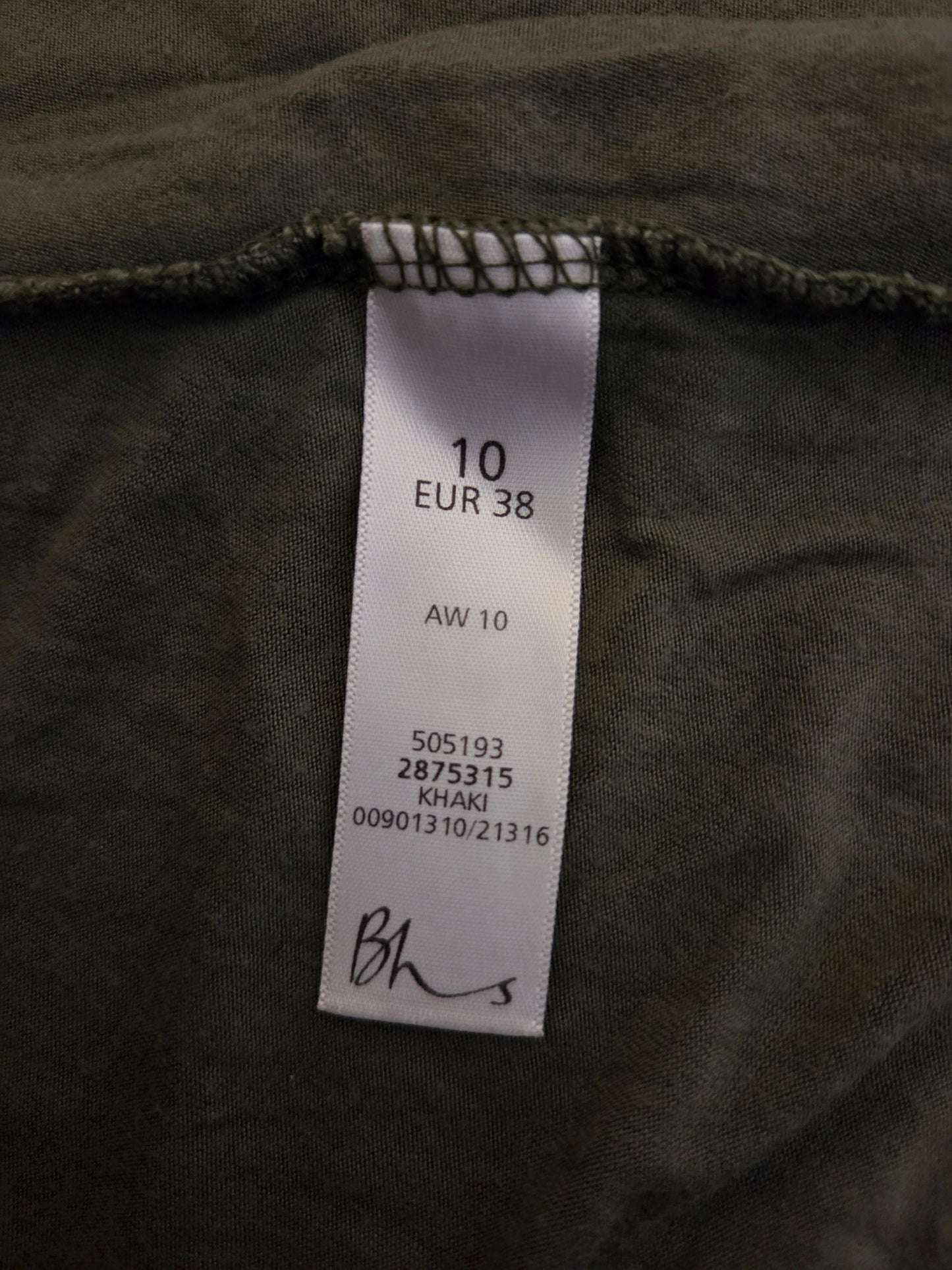 Clothing label on a dark fabric background