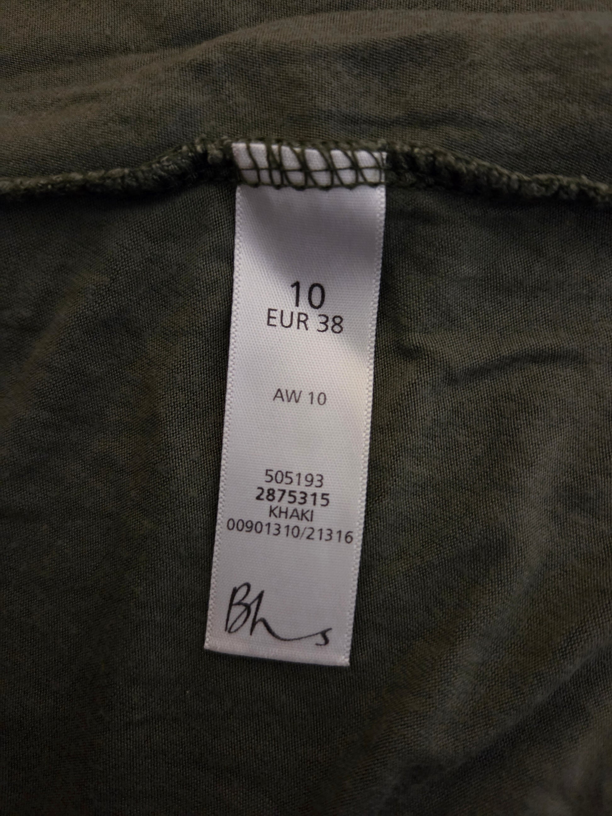 Clothing label on a dark fabric background