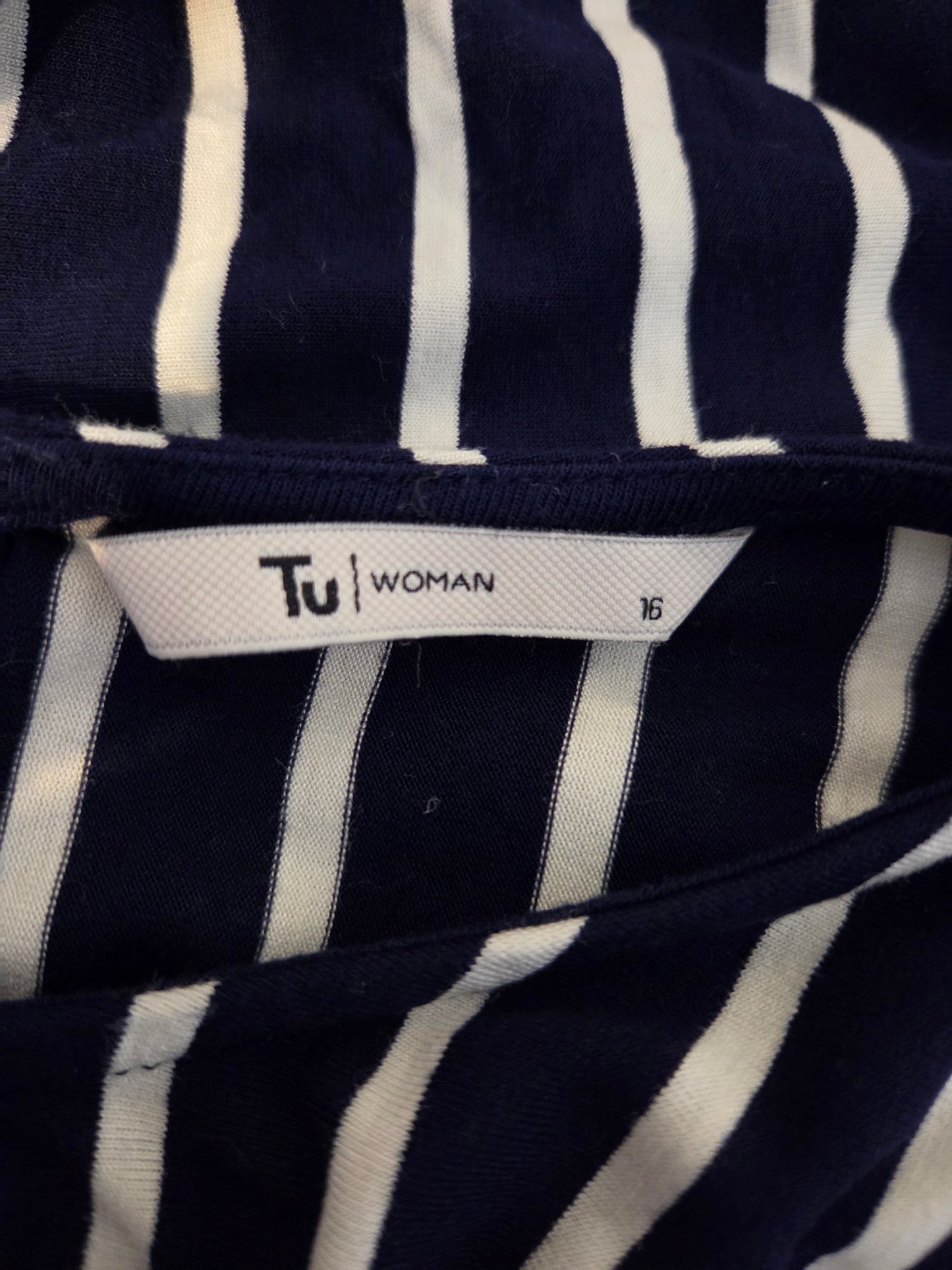 Navy and white striped fabric with a 'Tu Woman' label.