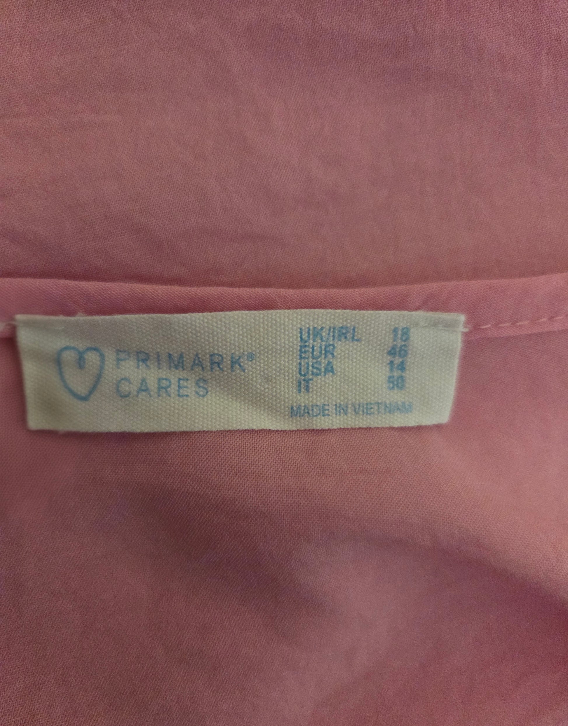 Close-up of a Primark size 
label 