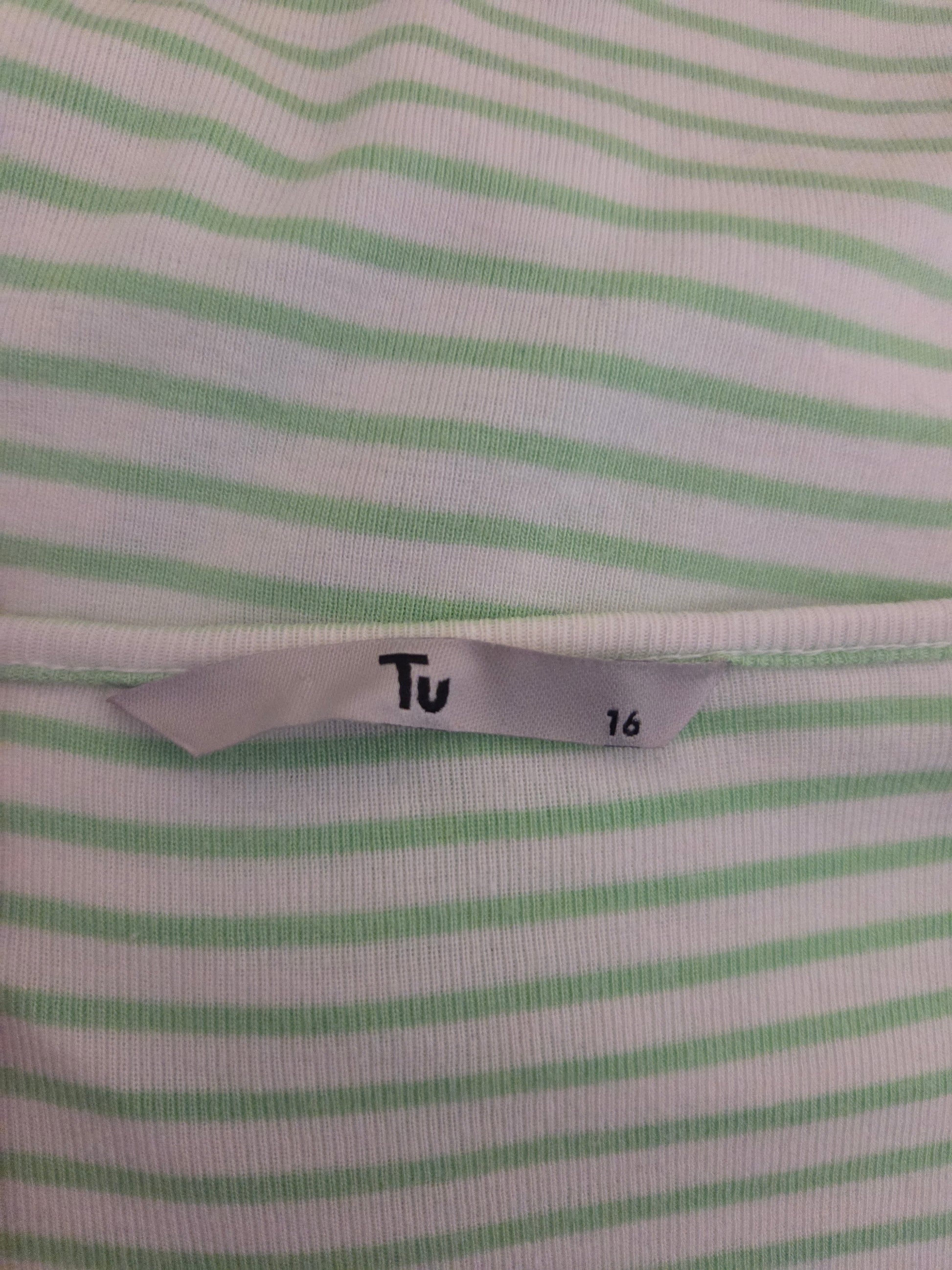 Close-up of a fabric with green stripes and a size label