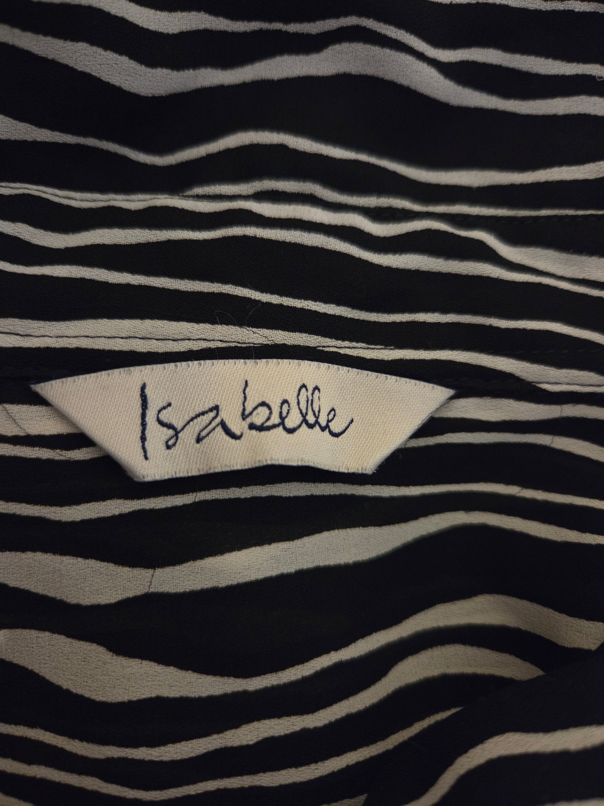 Black and white striped fabric with 'Isabelle' label