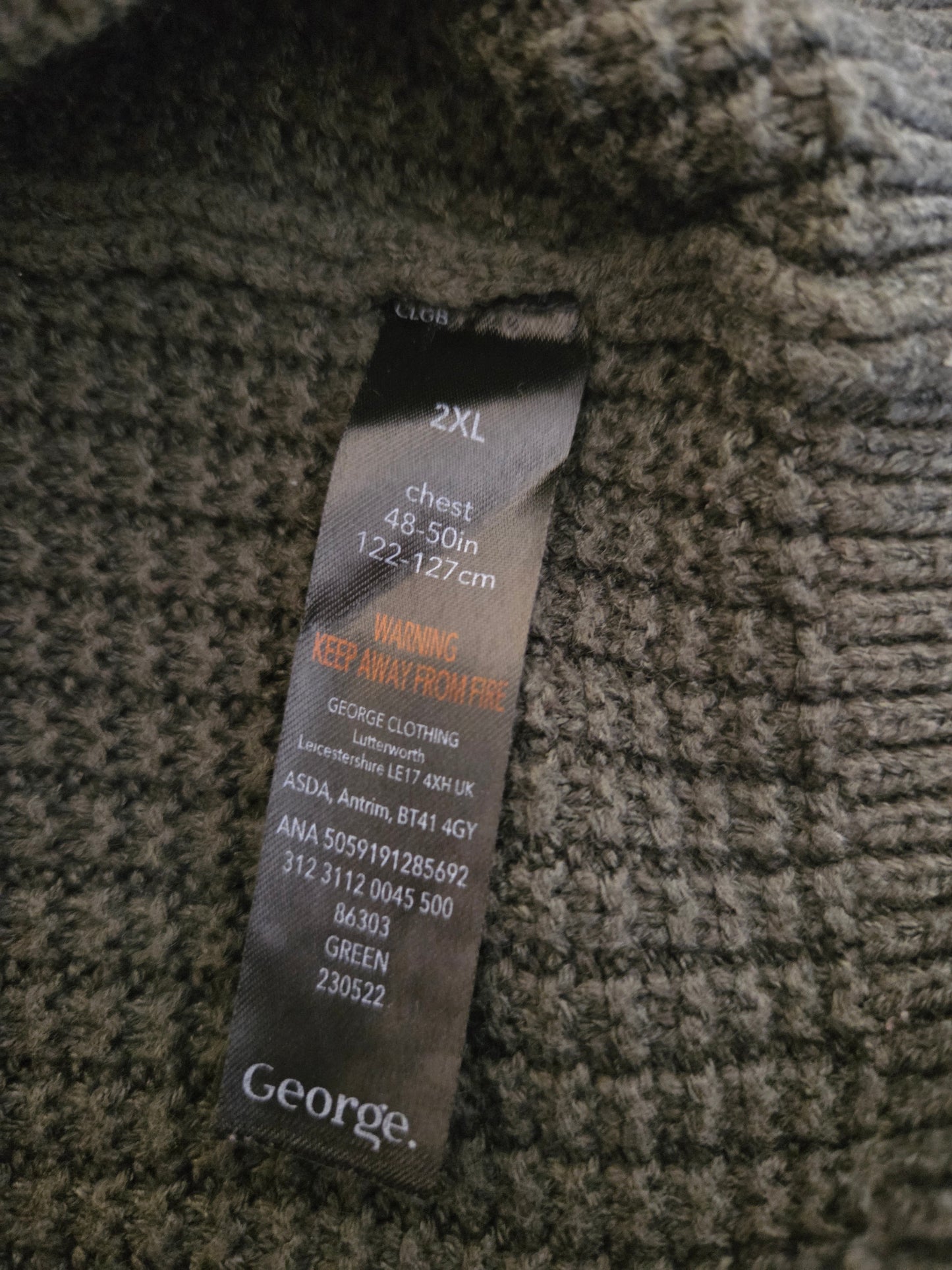 Clothing tag on a textured fabric background