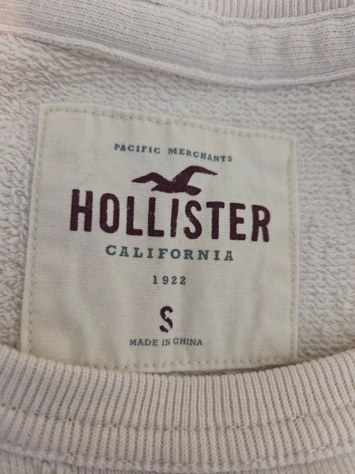 Hollister California label on a textured fabric background
