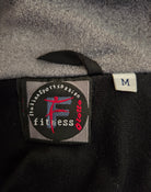 Close-up of a label on a piece of clothing with branding details.