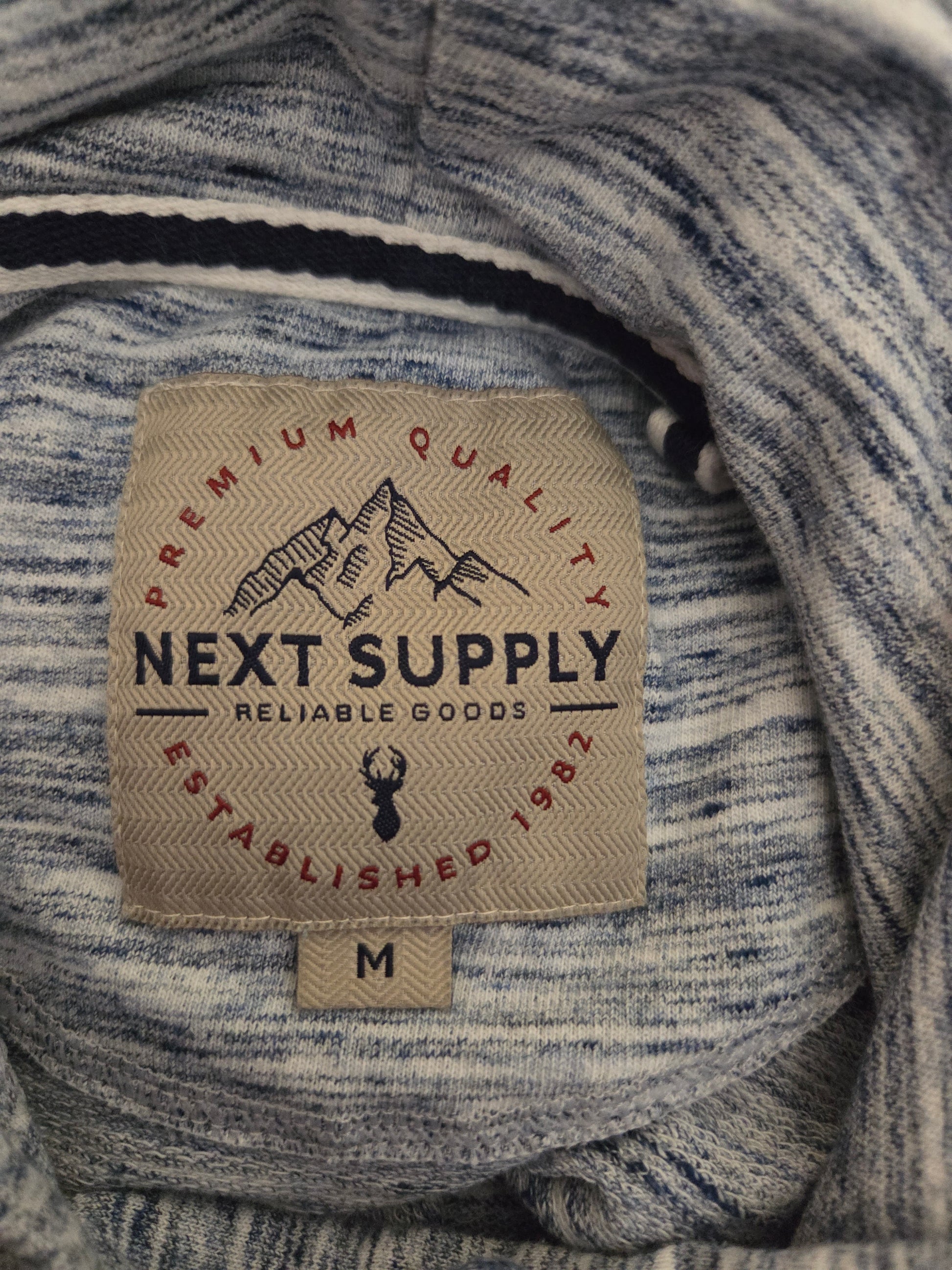Next Supply light blue marl hoodie label