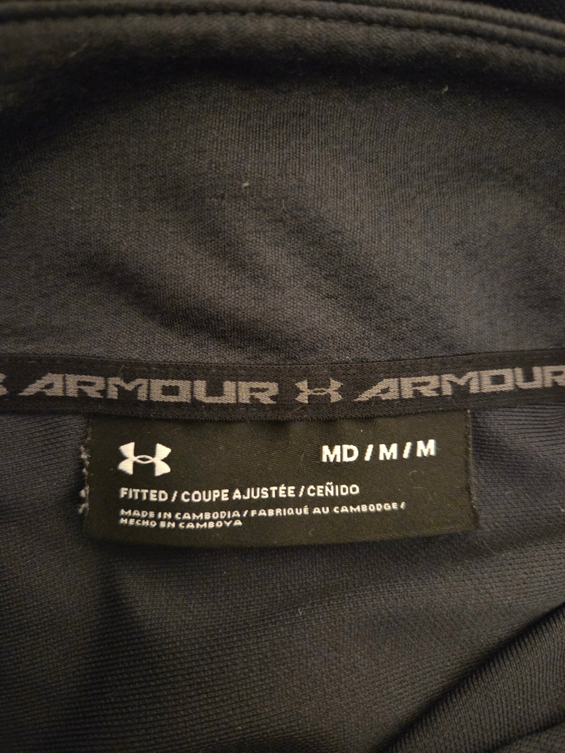 Close-up of Under Armour label on a black garment