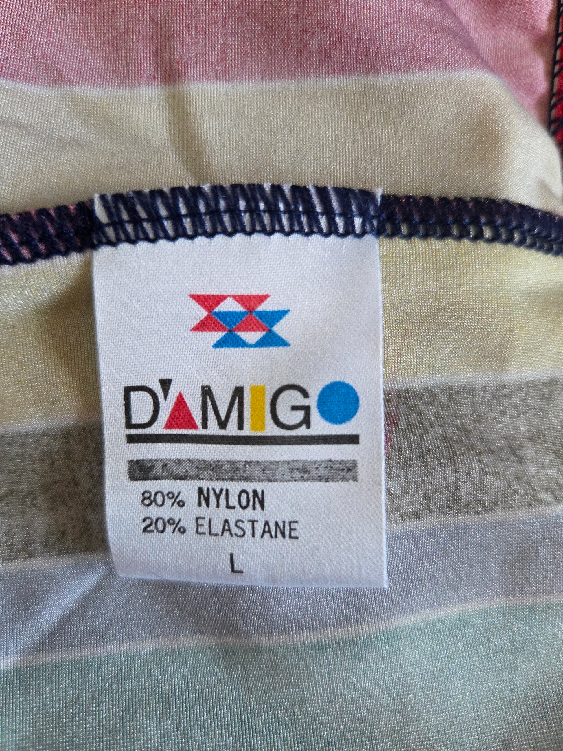 Fabric label with 'Damigo' brand name and material information on a striped fabric background.