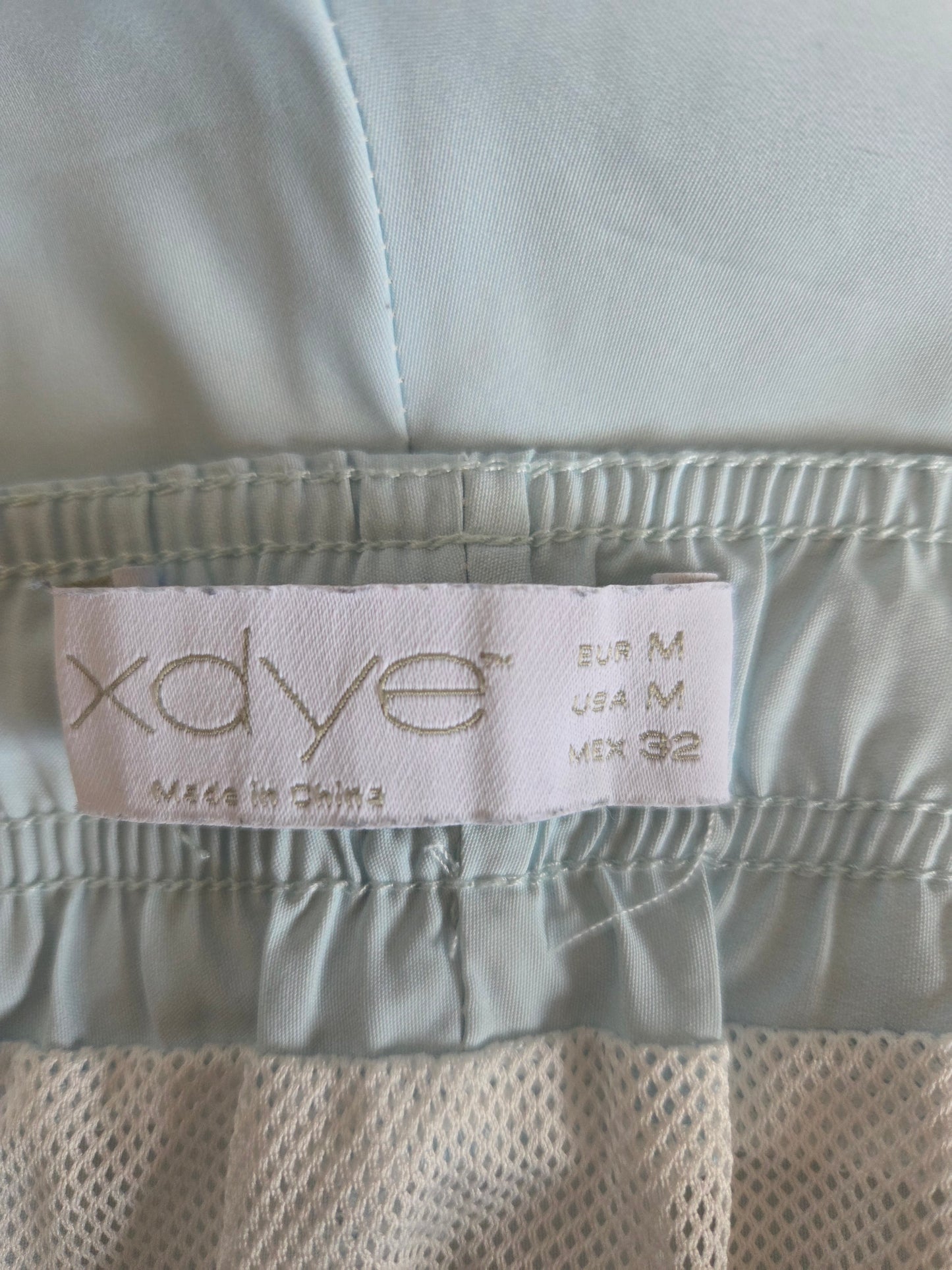 Close-up of a label on a piece of light-colored fabric 