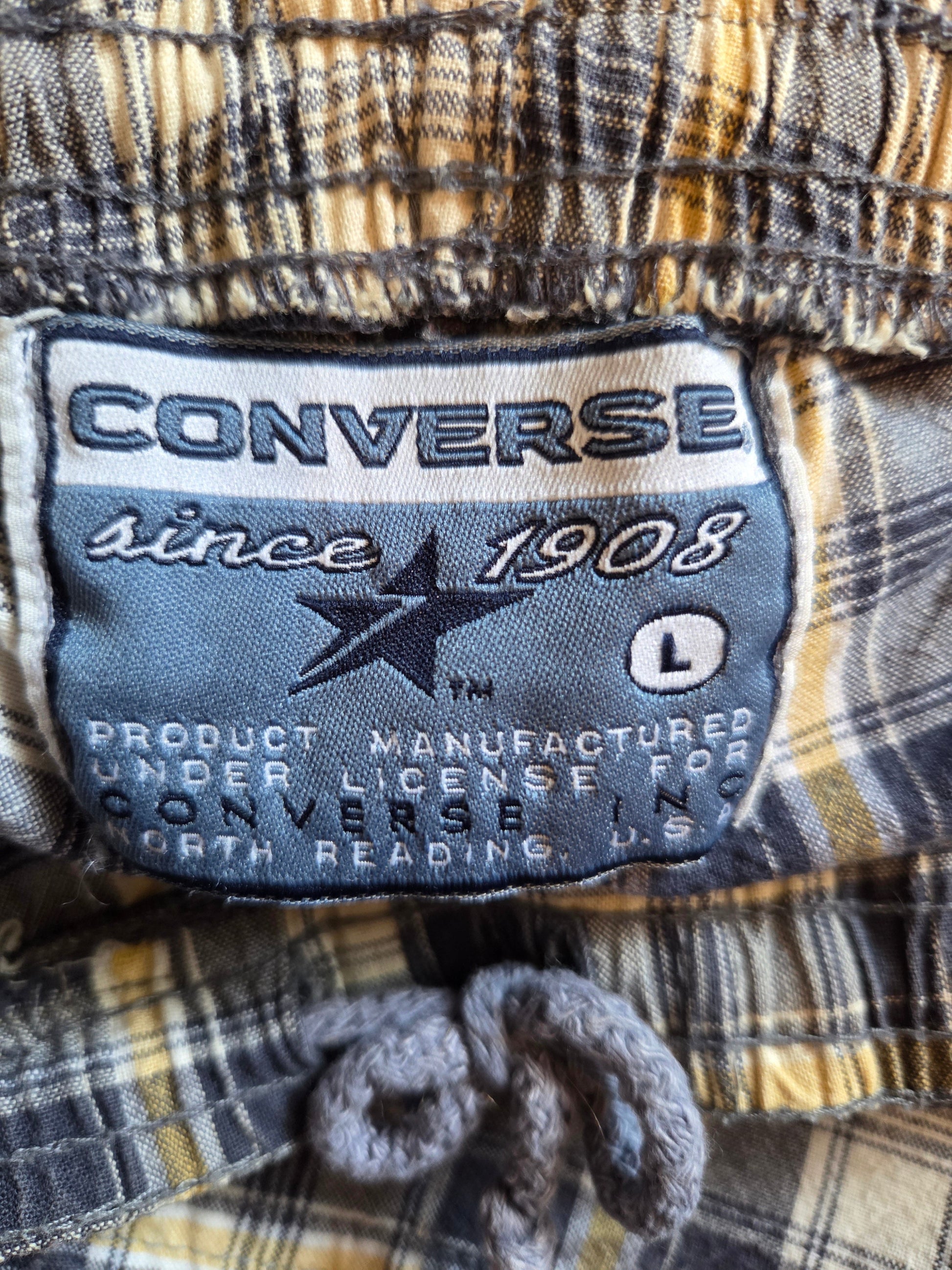 Converse Size label on a plaid pair of shorts