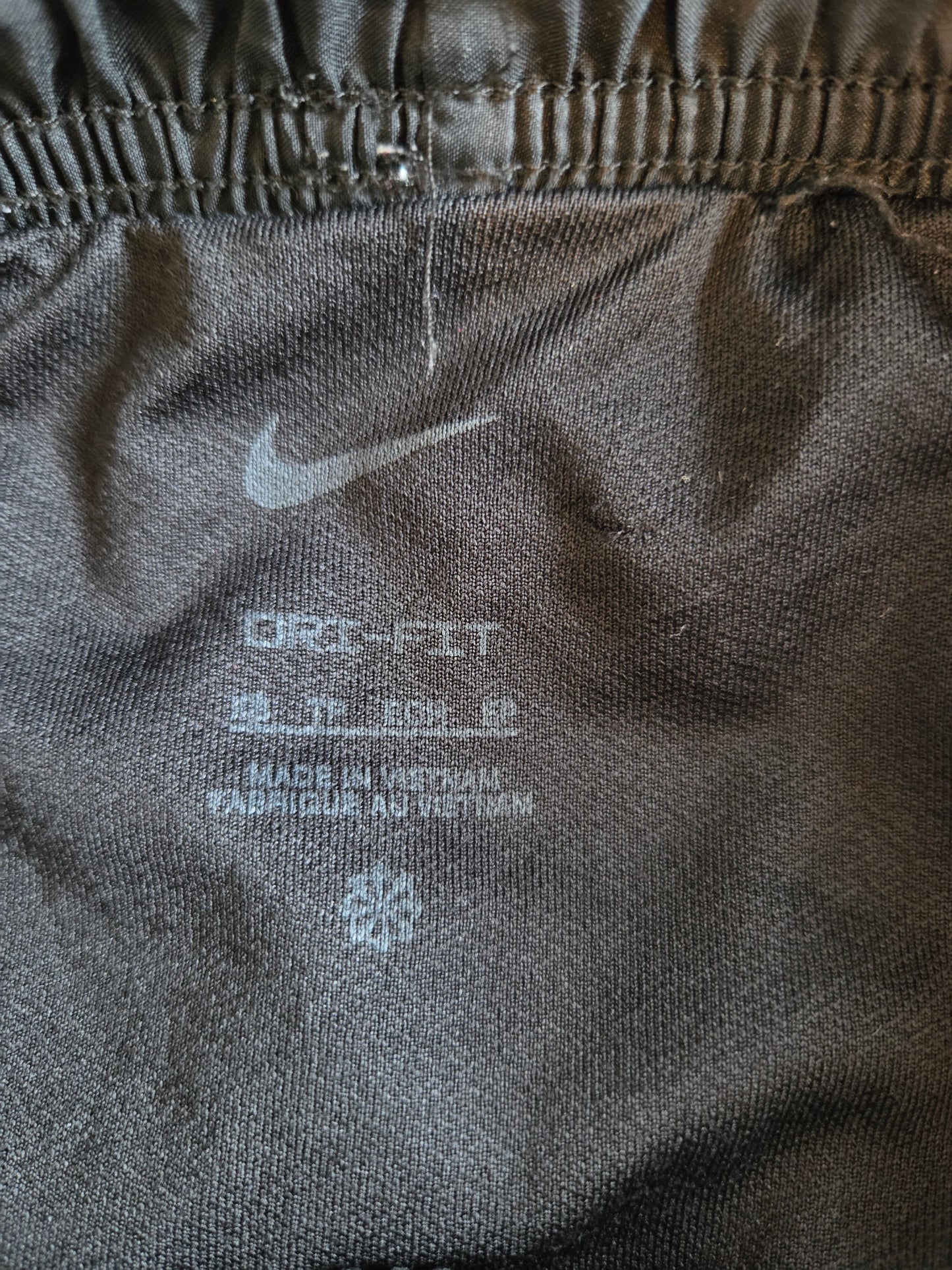 Size label on black shorts