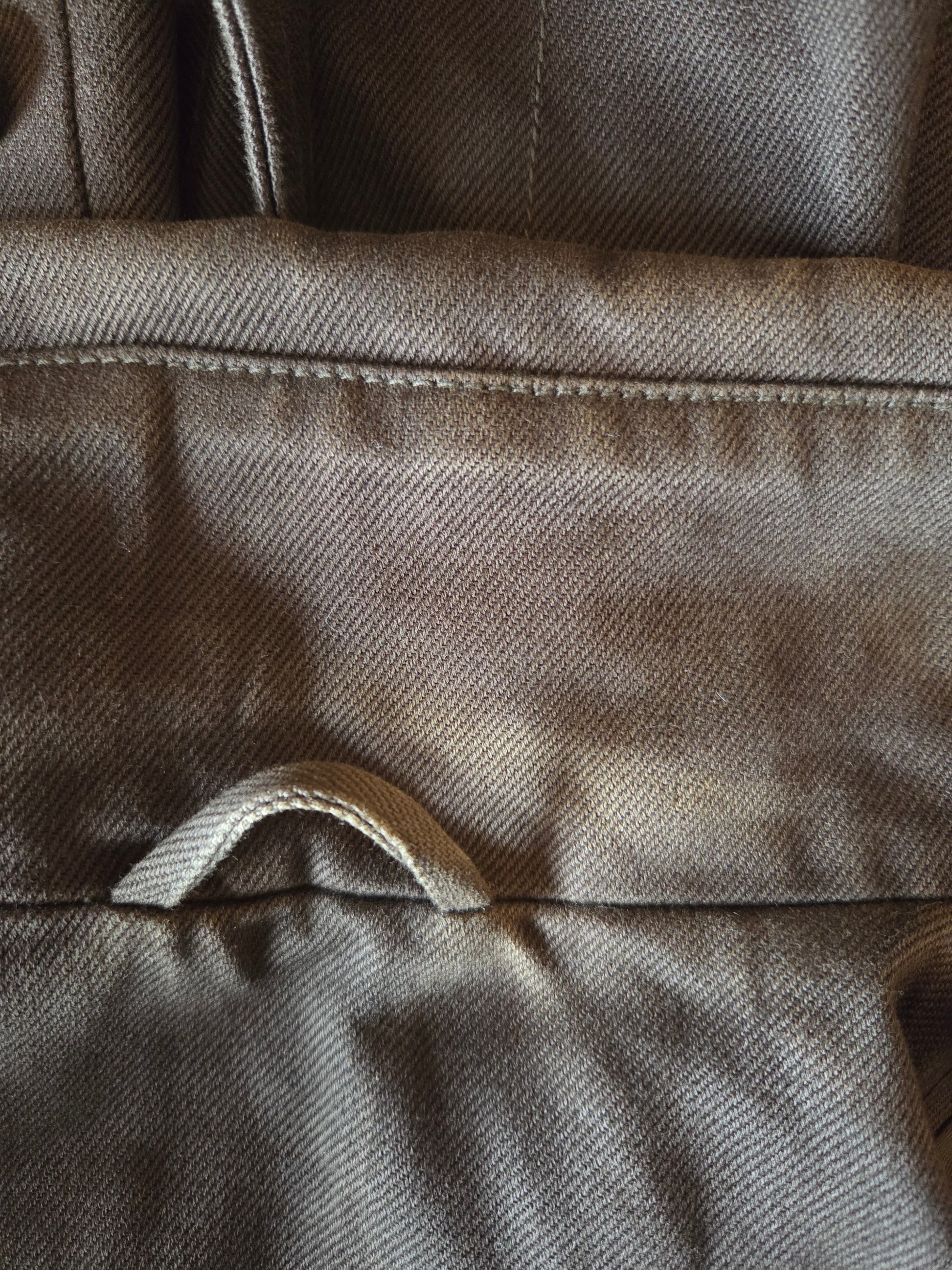 Close-up of a textured brown fabric surface
