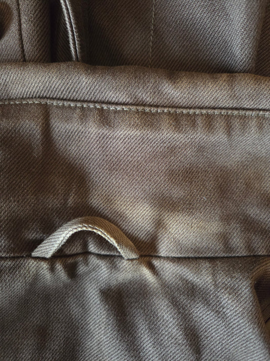 Close-up of a textured brown fabric surface