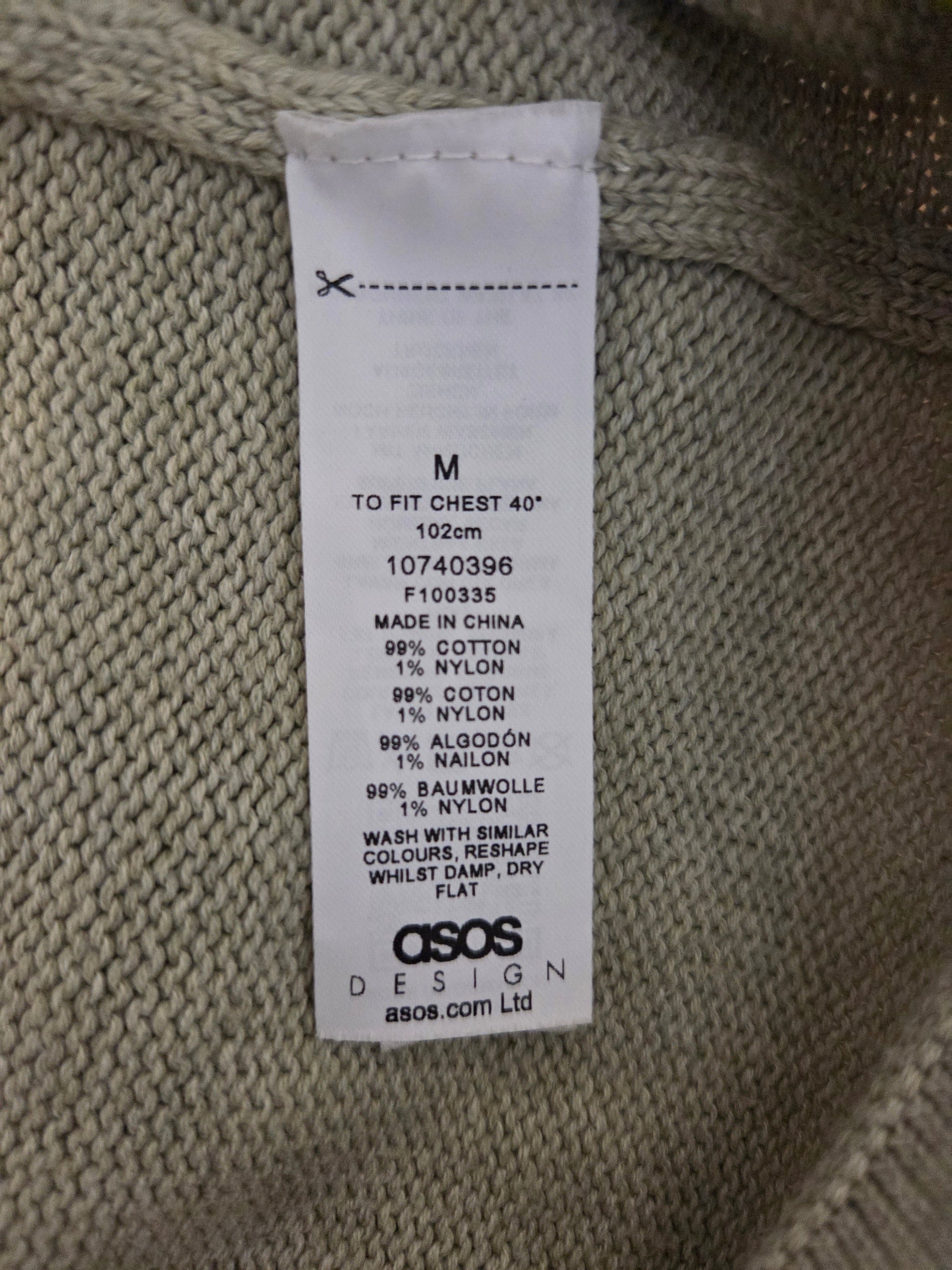 Size label on a knitted garment with ASOS branding